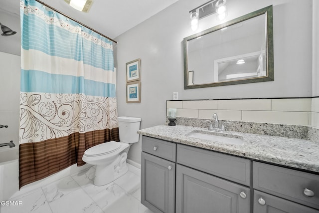bathroom featuring vanity, toilet, shower / bathtub combination with curtain, marble finish floor, and baseboards