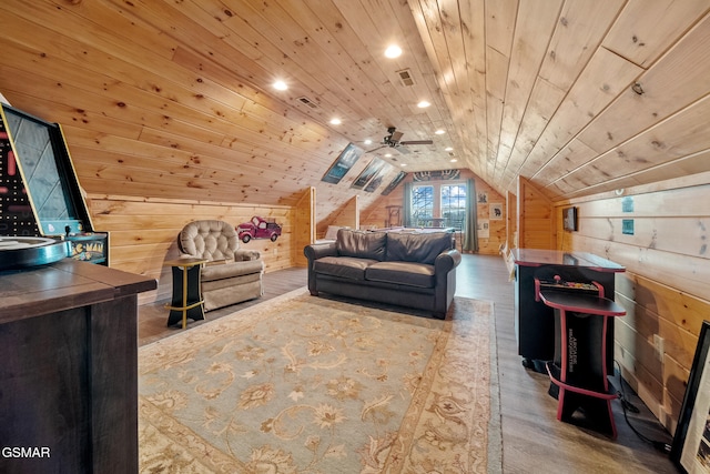 interior space with visible vents, wood finished floors, lofted ceiling, wooden walls, and recessed lighting