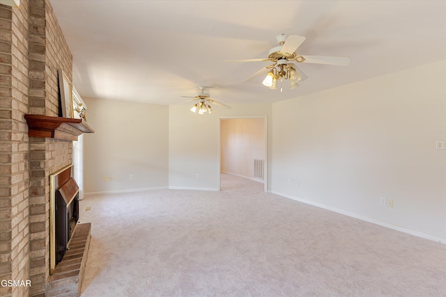 unfurnished living room featuring visible vents, a brick fireplace, baseboards, and carpet floors