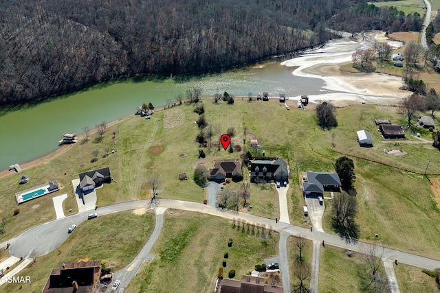 bird's eye view featuring a water view and a view of trees