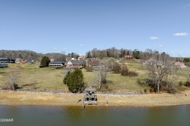 birds eye view of property featuring a water view