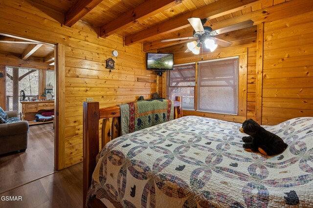 331 Caney Creek Rd, Pigeon Forge, TN 37863 - bedroom featuring a wooden ceiling with exposed beams, wooden walls, and wood finished floors