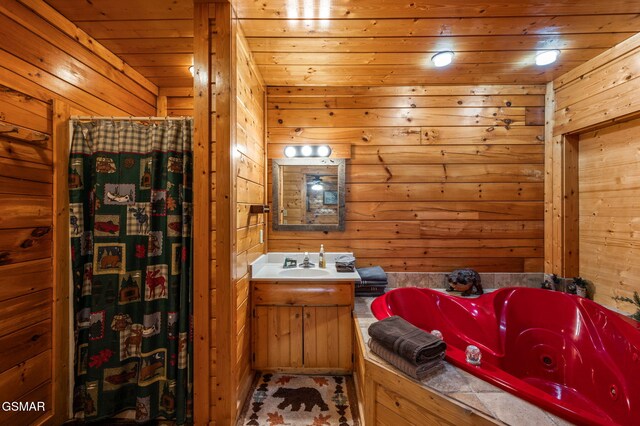 331 Caney Creek Rd, Pigeon Forge, TN 37863 - bathroom featuring a whirlpool tub, vanity, wooden walls, wood ceiling, and a shower with shower curtain