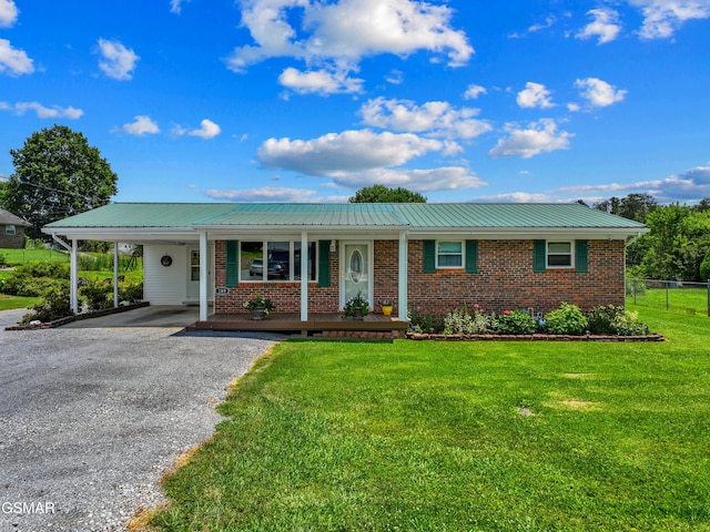 189 Terry St, Newport, TN 37821 - ranch-style home featuring brick siding, a porch, driveway, a metal roof, and an attached carport