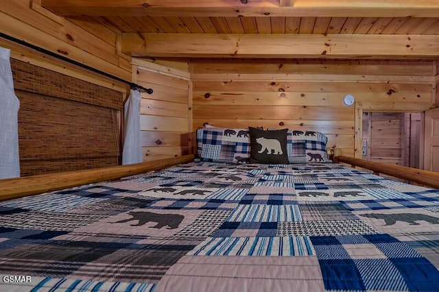 bedroom with beamed ceiling, wood walls, and wooden ceiling