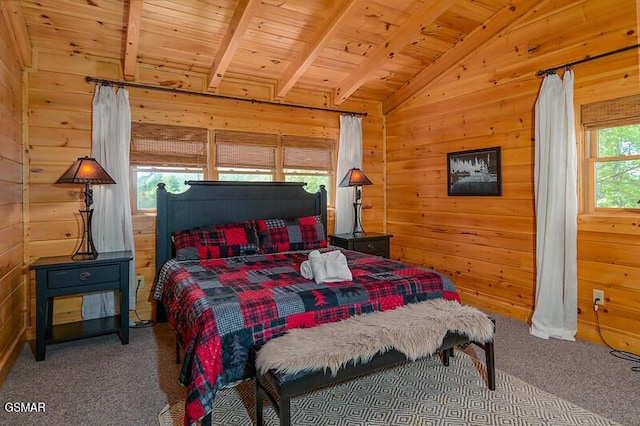 carpeted bedroom with wooden walls, wood ceiling, and vaulted ceiling with beams