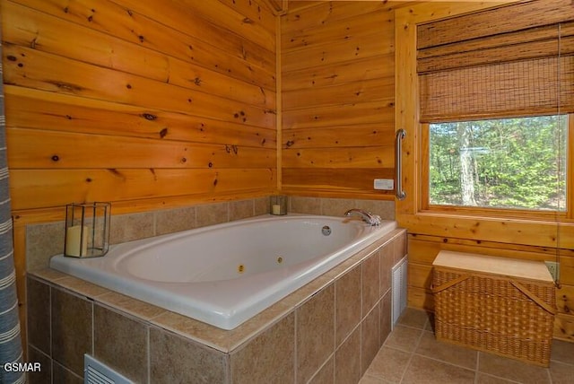 full bath with tile patterned floors and a tub with jets