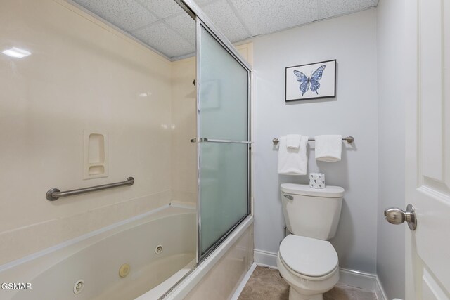 3215 N River Rd Ste 503, Pigeon Forge, TN 37863 - bathroom featuring tile patterned floors, a paneled ceiling, enclosed tub / shower combo, and toilet