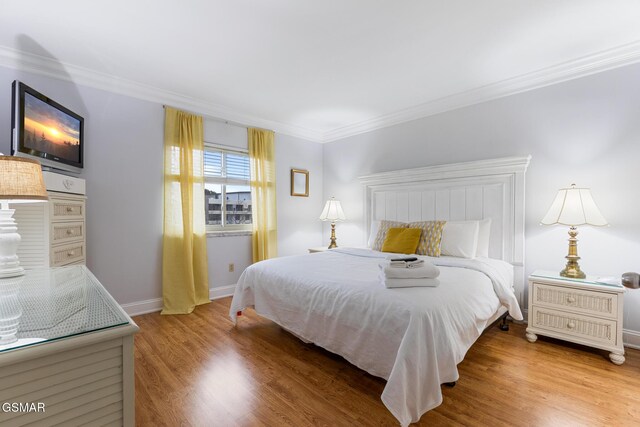 3215 N River Rd Ste 503, Pigeon Forge, TN 37863 - bedroom featuring wood-type flooring and crown molding