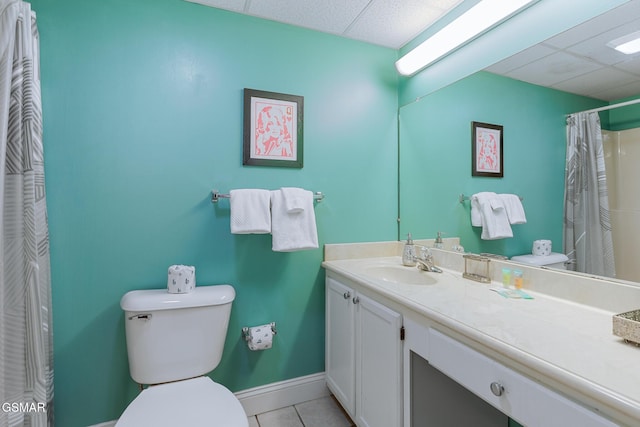3215 N River Rd Ste 503, Pigeon Forge, TN 37863 - bathroom featuring a drop ceiling, a shower with curtain, vanity, tile patterned flooring, and toilet