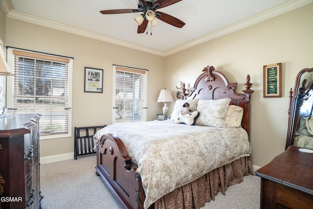 bedroom with ornamental molding, light colored carpet, and ceiling fan