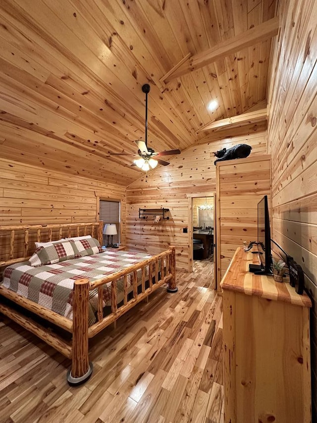 bedroom featuring wood walls, vaulted ceiling with beams, light hardwood / wood-style floors, and wooden ceiling