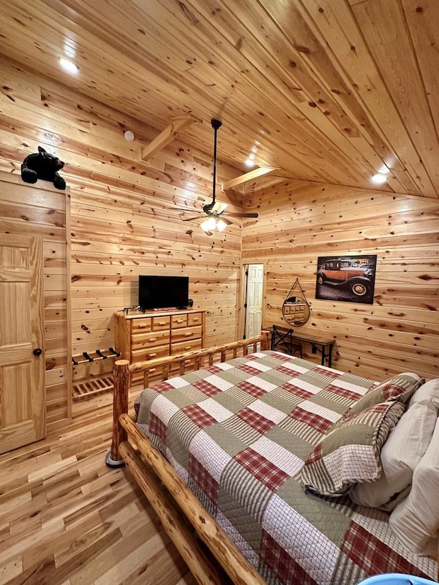 bedroom with wood walls, wood ceiling, vaulted ceiling, and wood-type flooring