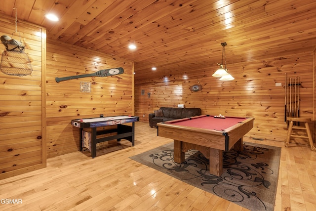 game room featuring wooden walls, hardwood / wood-style floors, pool table, and wood ceiling