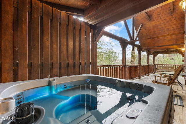 view of swimming pool featuring a hot tub