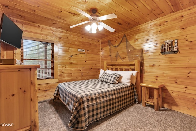 bedroom with wooden walls, wooden ceiling, and carpet flooring