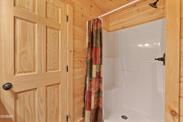 2377 Alpine Village Way, Pigeon Forge, TN 37863 - bathroom featuring curtained shower and wooden walls