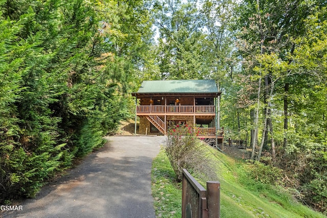 log cabin with a deck