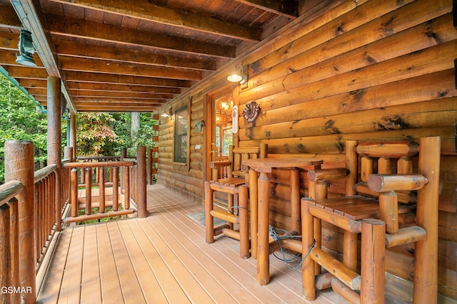 wooden terrace featuring a porch