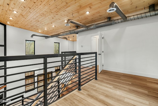 interior space featuring wooden ceiling and wood-type flooring