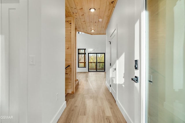 hallway featuring wood ceiling and light hardwood / wood-style flooring