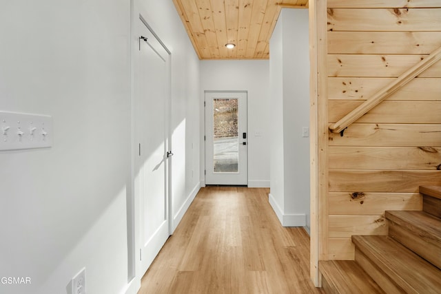 hall featuring wooden ceiling and light hardwood / wood-style floors