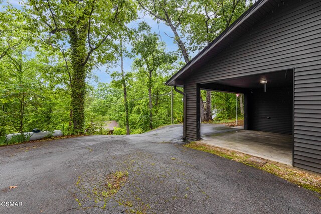 2887 Pine Haven Dr, Sevierville, TN 37862 - view of parking with a carport and asphalt driveway
