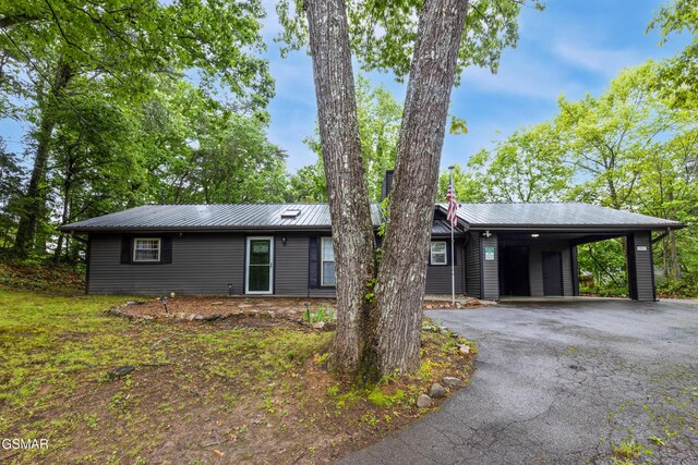 2887 Pine Haven Dr, Sevierville, TN 37862 - view of front of property with asphalt driveway, metal roof, and a carport