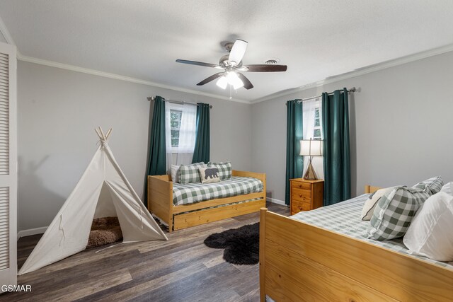 2887 Pine Haven Dr, Sevierville, TN 37862 - bedroom featuring wood finished floors, ornamental molding, ceiling fan, and baseboards