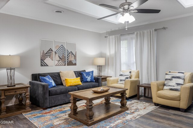 2887 Pine Haven Dr, Sevierville, TN 37862 - living area with wood finished floors, a ceiling fan, and ornamental molding