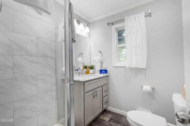 2887 Pine Haven Dr, Sevierville, TN 37862 - full bath with toilet, crown molding, vanity, a shower stall, and wood finished floors