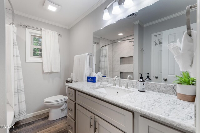 2887 Pine Haven Dr, Sevierville, TN 37862 - bathroom with wood finished floors, toilet, crown molding, baseboards, and a shower with shower curtain