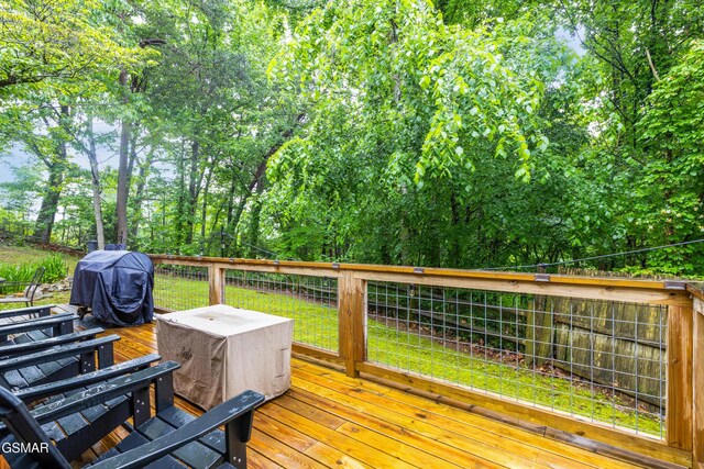 2887 Pine Haven Dr, Sevierville, TN 37862 - wooden terrace featuring a yard, grilling area, and view of scattered trees