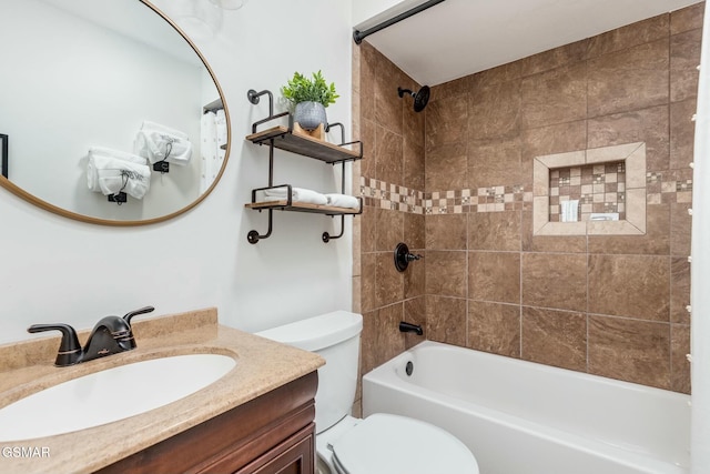 bathroom featuring toilet, vanity, and bathing tub / shower combination