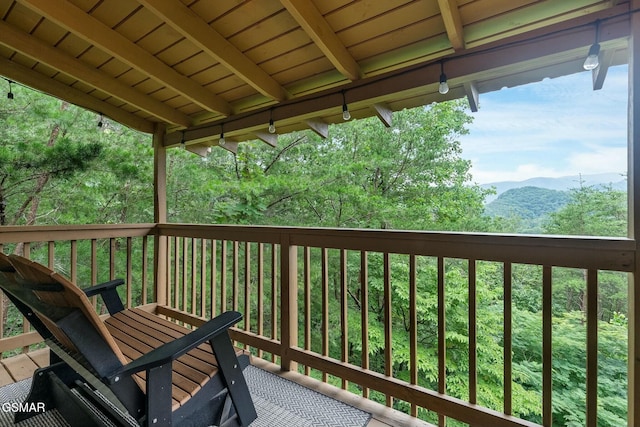 wooden deck featuring a mountain view