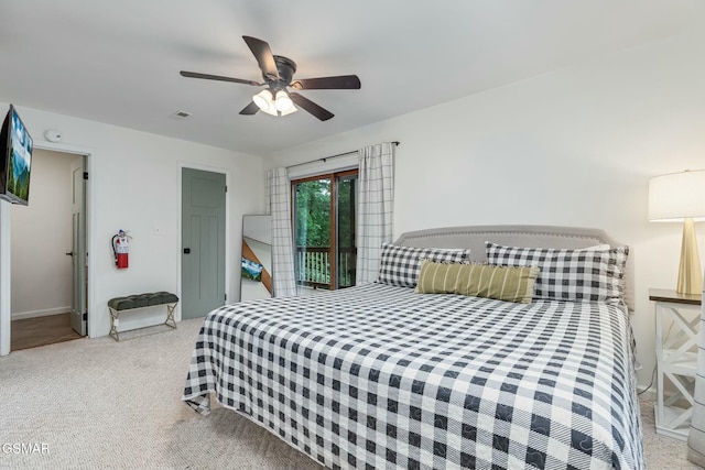 bedroom with carpet floors, access to exterior, ceiling fan, and visible vents