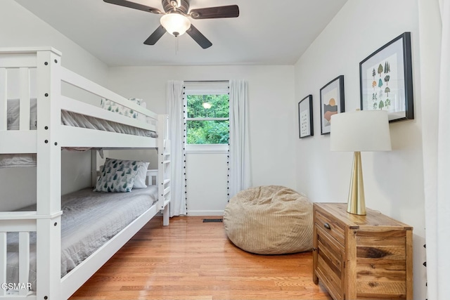 bedroom with ceiling fan and wood finished floors