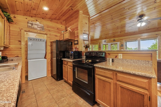 1830 Blue Tick Way, Sevierville, TN 37876 - kitchen featuring black appliances, stacked washer and clothes dryer, wooden ceiling, a peninsula, and healthy amount of natural light