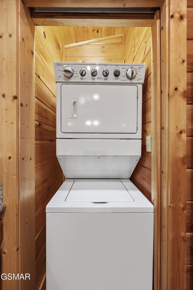 1830 Blue Tick Way, Sevierville, TN 37876 - laundry area featuring stacked washer / dryer and wood walls