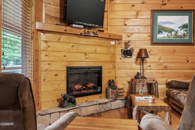 1830 Blue Tick Way, Sevierville, TN 37876 - living area featuring a glass covered fireplace, wood finished floors, and wooden walls
