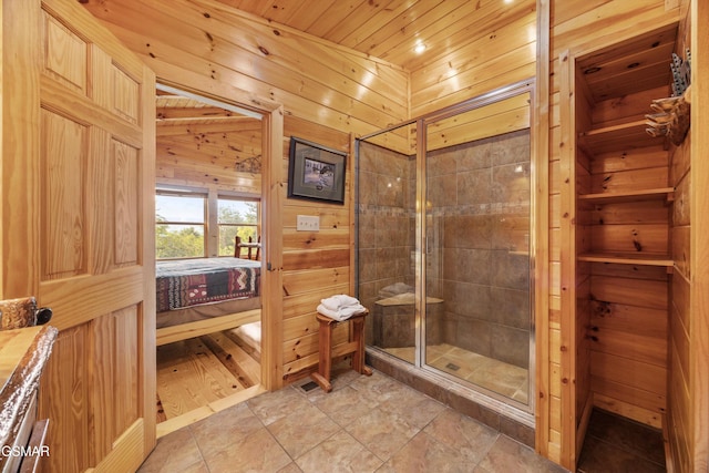 1830 Blue Tick Way, Sevierville, TN 37876 - bathroom with a shower stall, wood walls, wooden ceiling, and connected bathroom