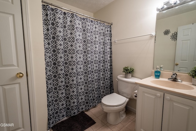 full bathroom featuring a shower with shower curtain, toilet, tile patterned flooring, and vanity