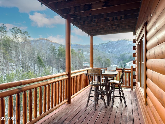 wooden deck featuring a mountain view