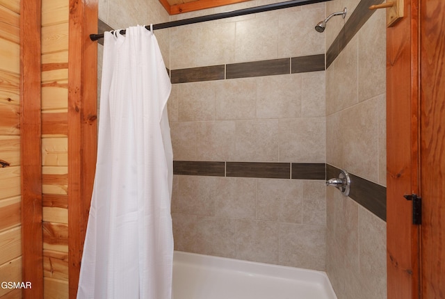 bathroom featuring curtained shower