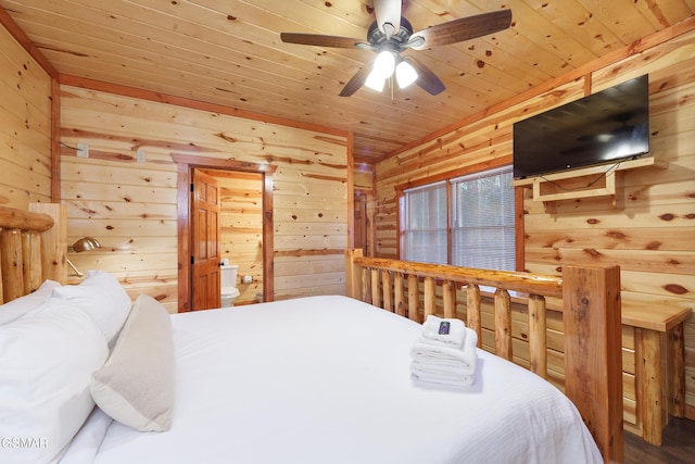 bedroom with wooden ceiling and wood walls