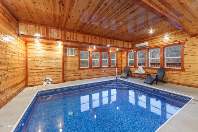 view of swimming pool featuring a wall mounted air conditioner and a jacuzzi