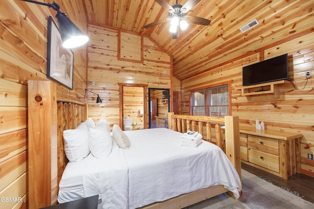 bedroom featuring wood ceiling, vaulted ceiling, hardwood / wood-style floors, and wood walls