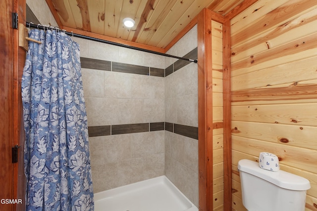 bathroom with toilet, wood ceiling, and walk in shower