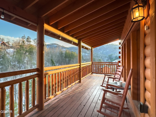 wooden terrace with a mountain view