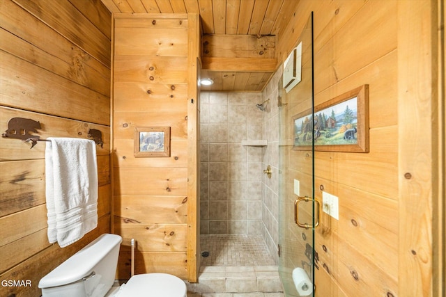 bathroom featuring toilet, wood ceiling, walk in shower, and wooden walls